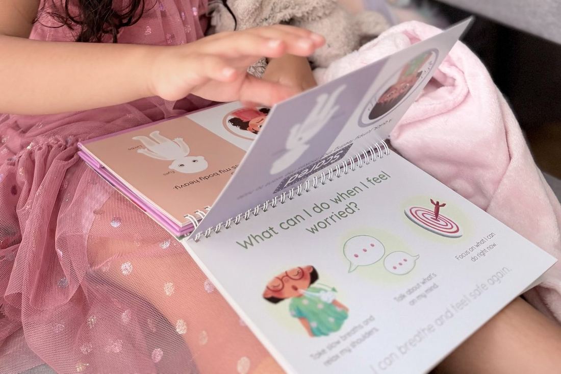 Child flipping through kit