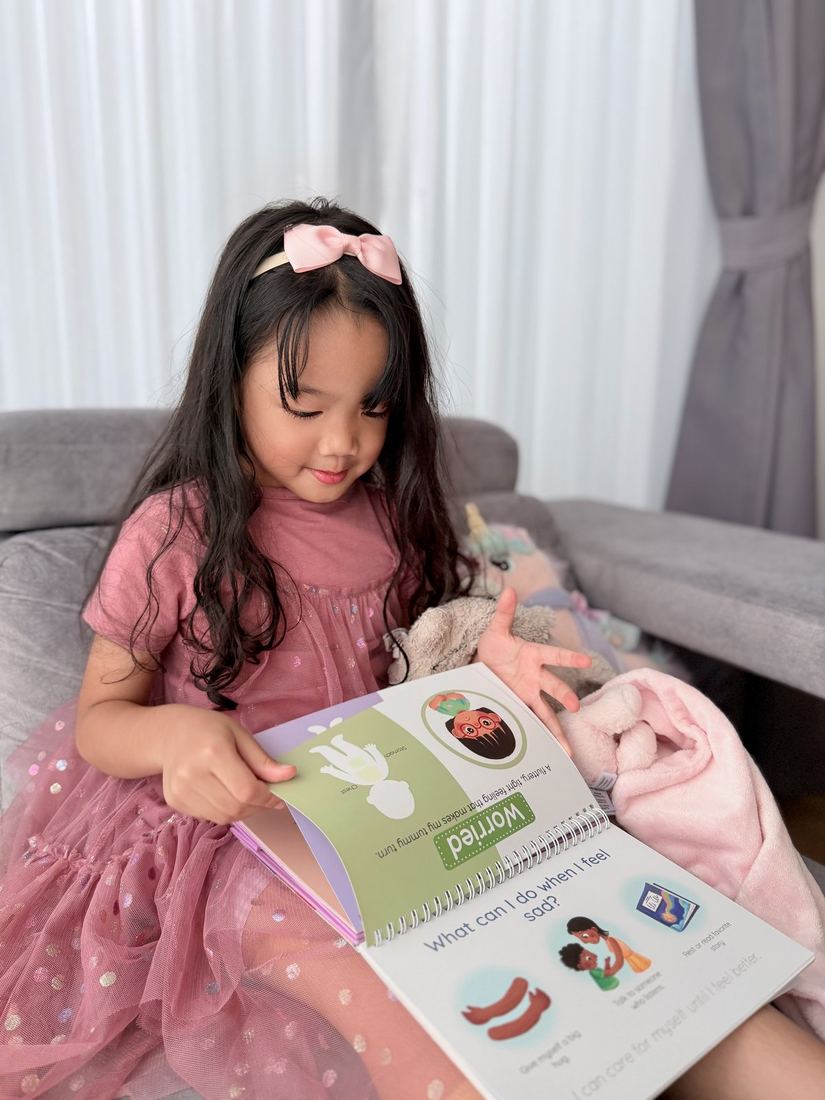 Child independently reading the kit